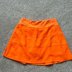 ORANGE TENNIS SKIRT